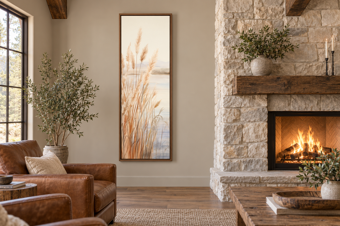 Vertical framed canvas wall art of pampas grass on a beach in a neutral-toned living room.