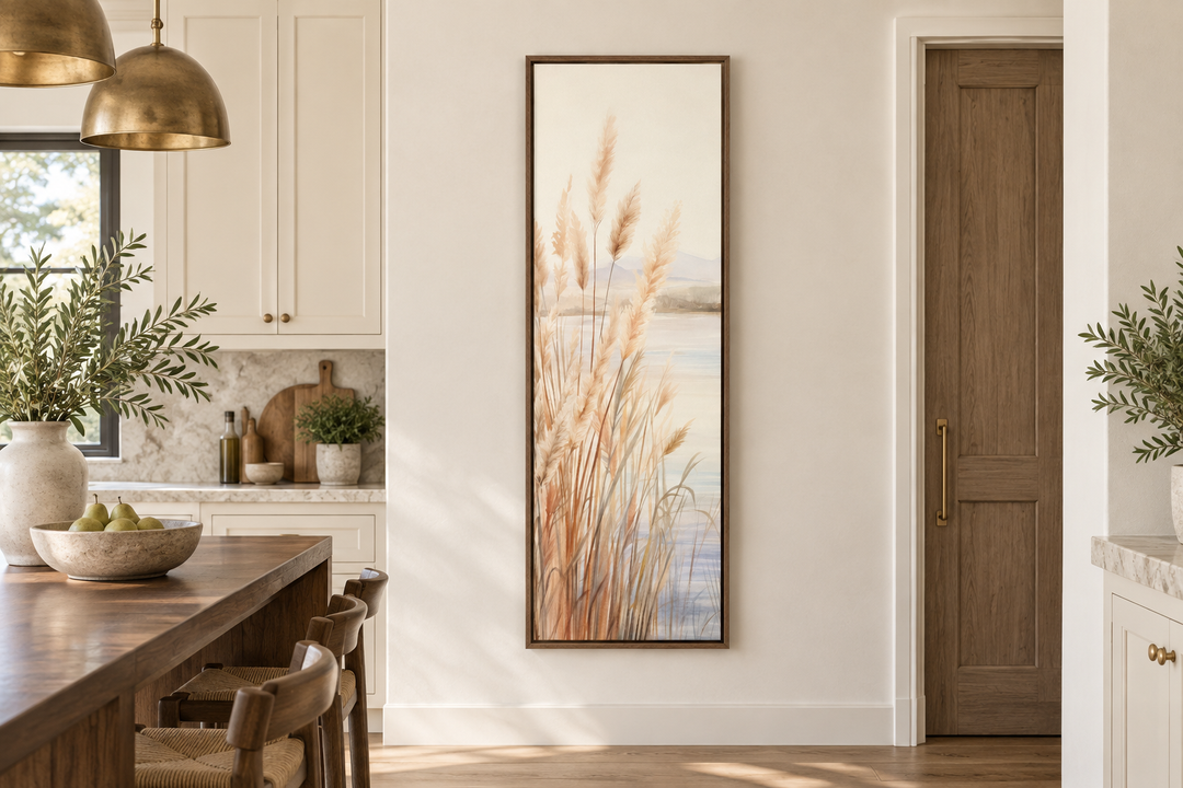 Vertical framed canvas wall art of pampas grass on a beach in neutral beige and sandy tones.