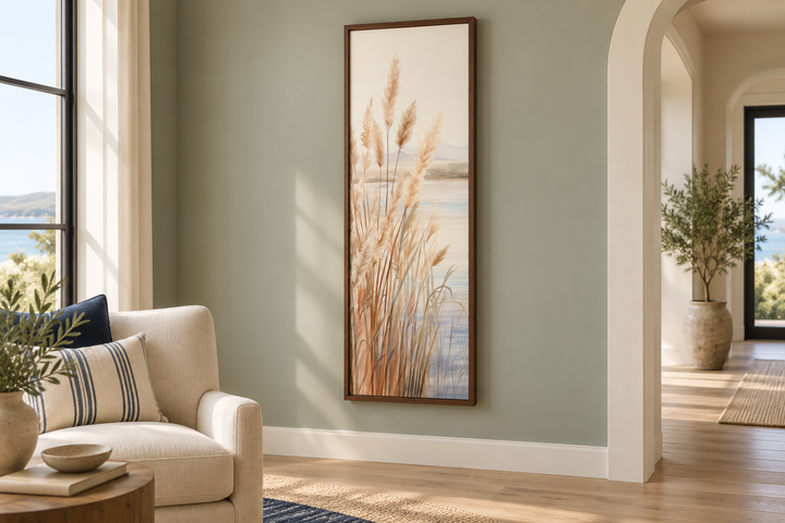 Vertical framed canvas wall art featuring neutral-toned pampas grass on a serene beach background.