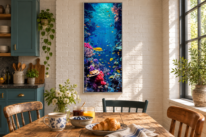 Tall narrow vertical framed canvas wall art of a vibrant underwater coral reef with tropical fish.