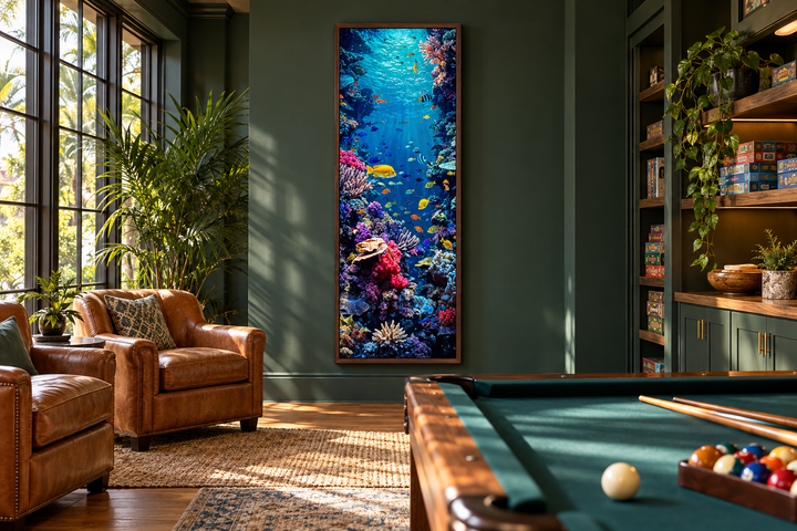 Tall narrow vertical framed canvas wall art of a vibrant underwater coral reef with tropical fish.