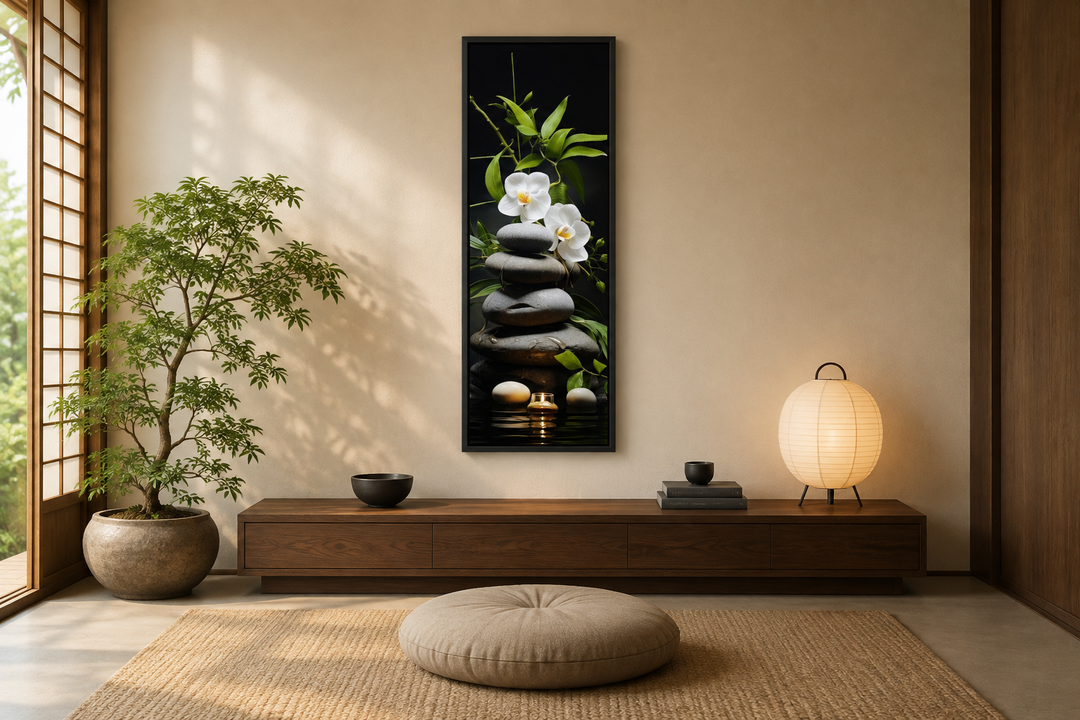 Tall narrow vertical canvas art of stacked rocks, white orchids, and bamboo in a zen room setting.