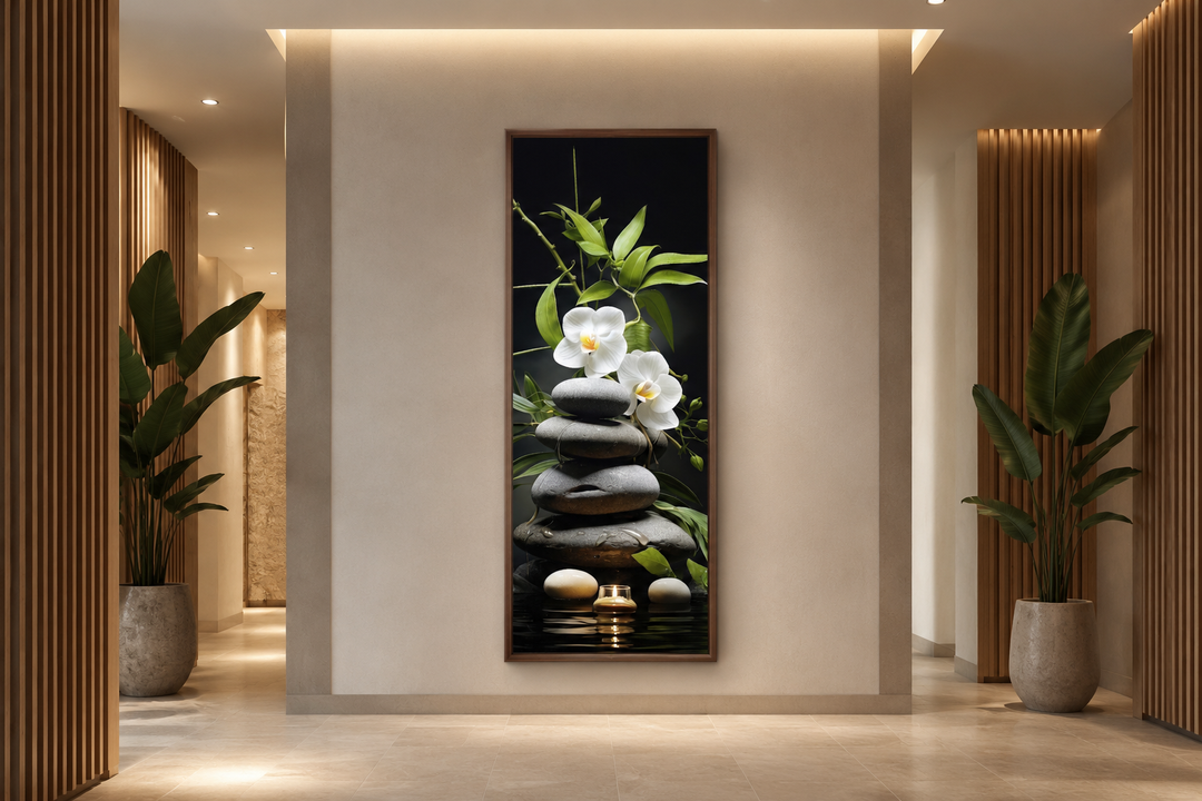 Tall narrow vertical canvas art of stacked rocks, white orchids, and a candle in a modern hallway.