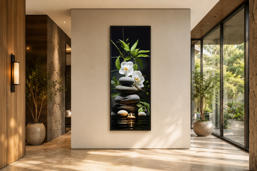 Tall narrow vertical canvas art of stacked rocks, white orchids, bamboo, and a candle in a hallway.