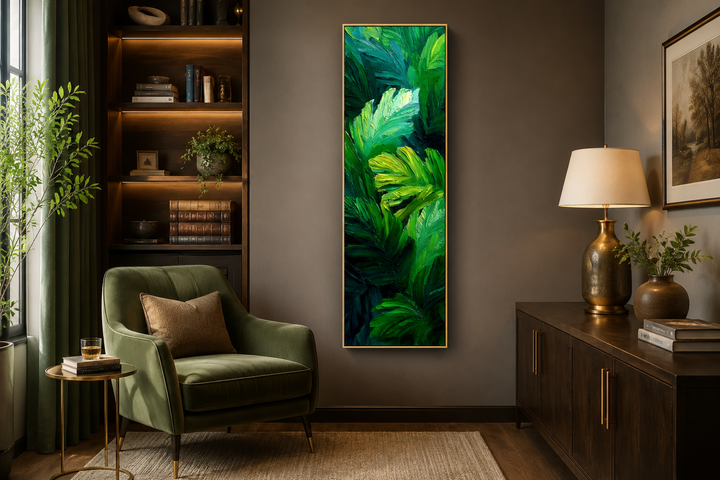 Vertical canvas print of lush tropical leaves in vibrant green tones on a dark living room wall.