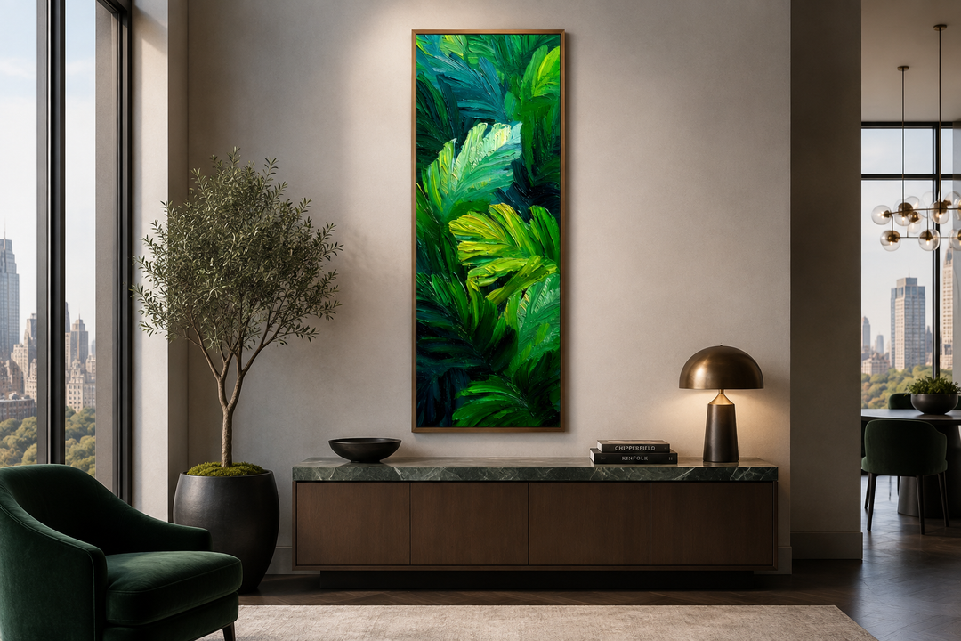 Vertical canvas print of lush tropical leaves in vibrant green tones on a modern living room wall.