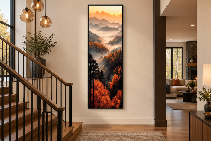 Tall vertical canvas wall art of a foggy mountain forest with orange autumn trees at sunset.