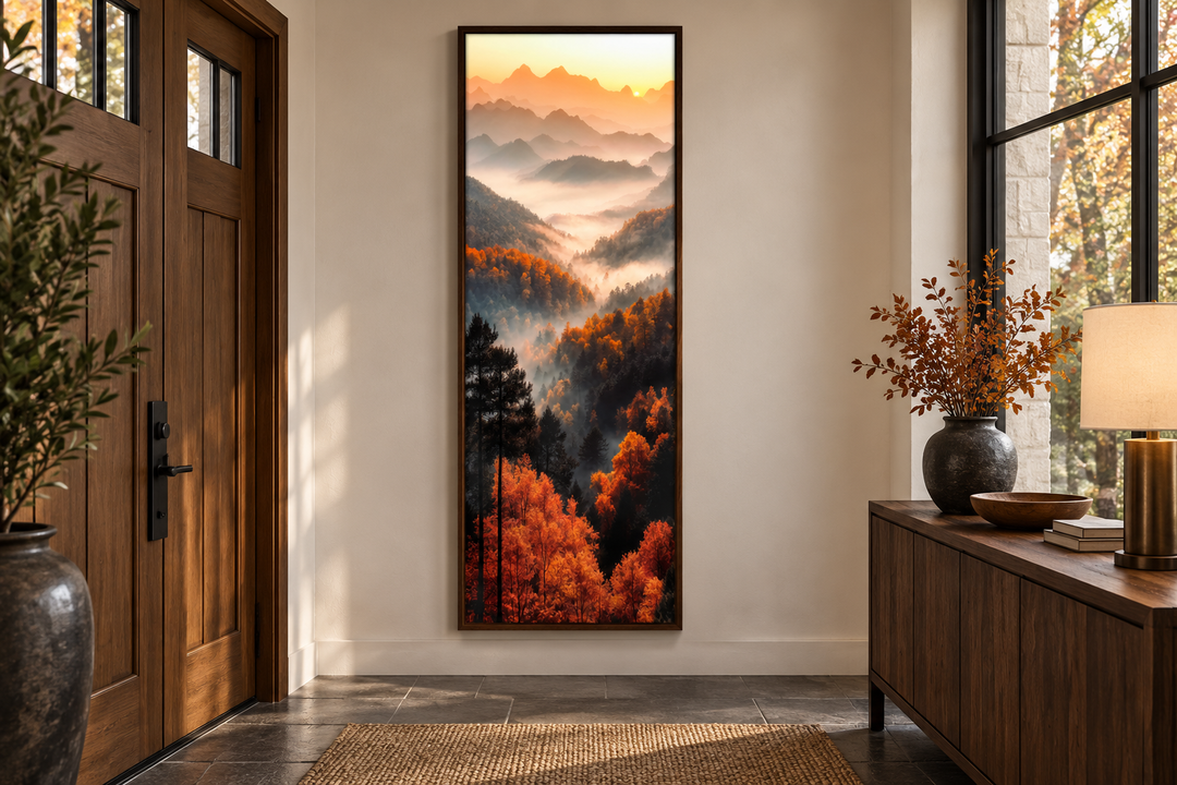 Tall vertical canvas art of a foggy mountain forest with orange autumn trees in a valley at sunset.