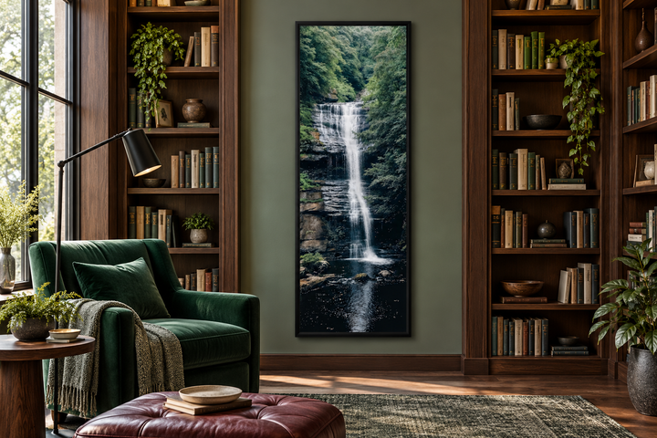 Tall narrow vertical framed canvas wall art of a serene waterfall in a lush green forest.