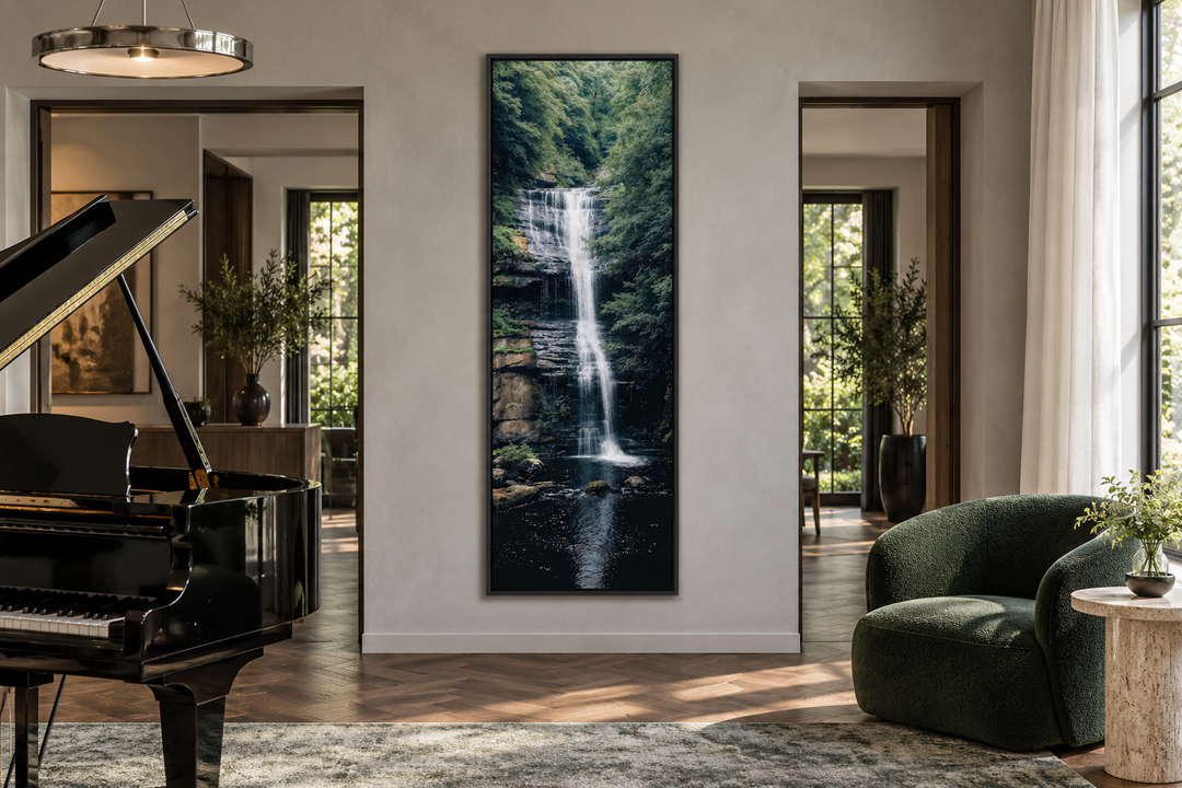 Tall narrow vertical framed canvas wall art of a serene waterfall in a lush green forest.