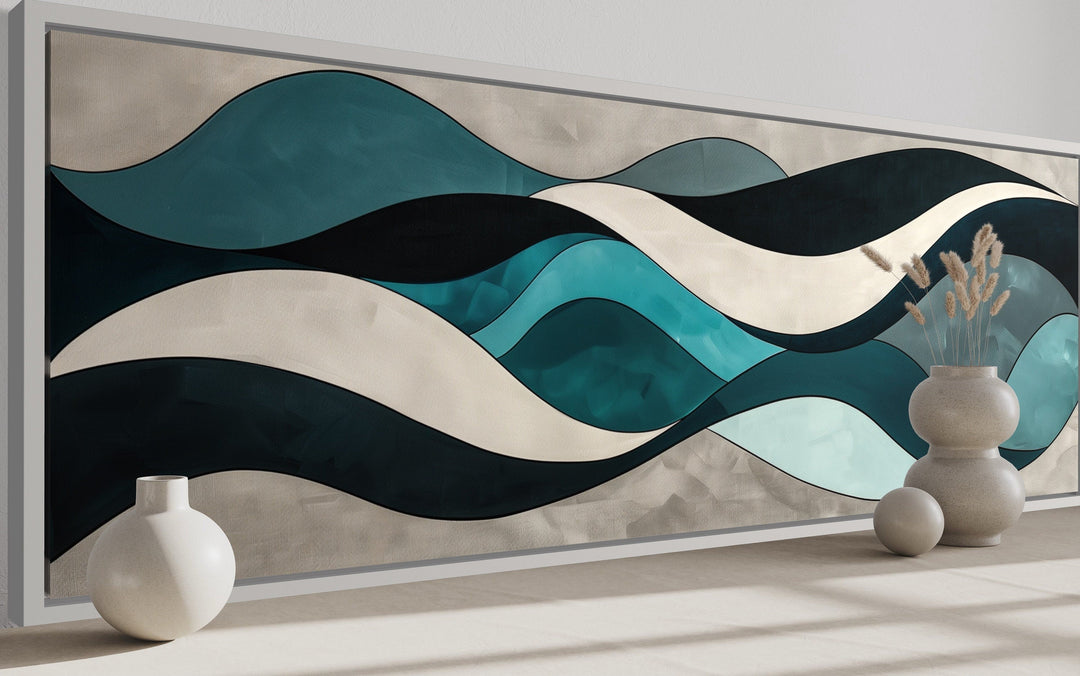 Long horizontal wall art featuring abstract teal, blue, and grey waves in a modern frame.