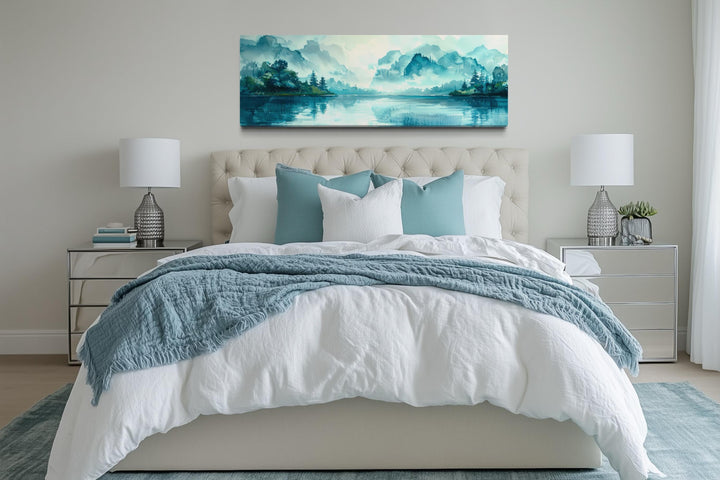 Teal mountain lake horizontal canvas wall art hanging above a bed in a modern bedroom.