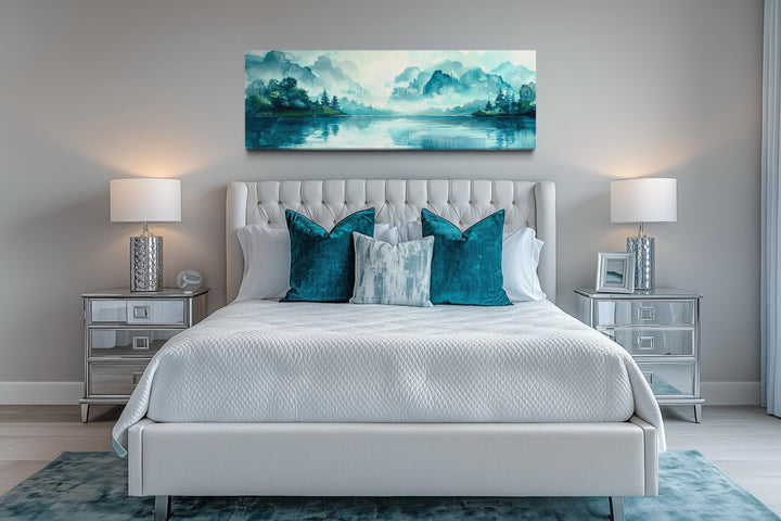 Teal mountain lake horizontal canvas wall art hanging above a bed in a modern bedroom.