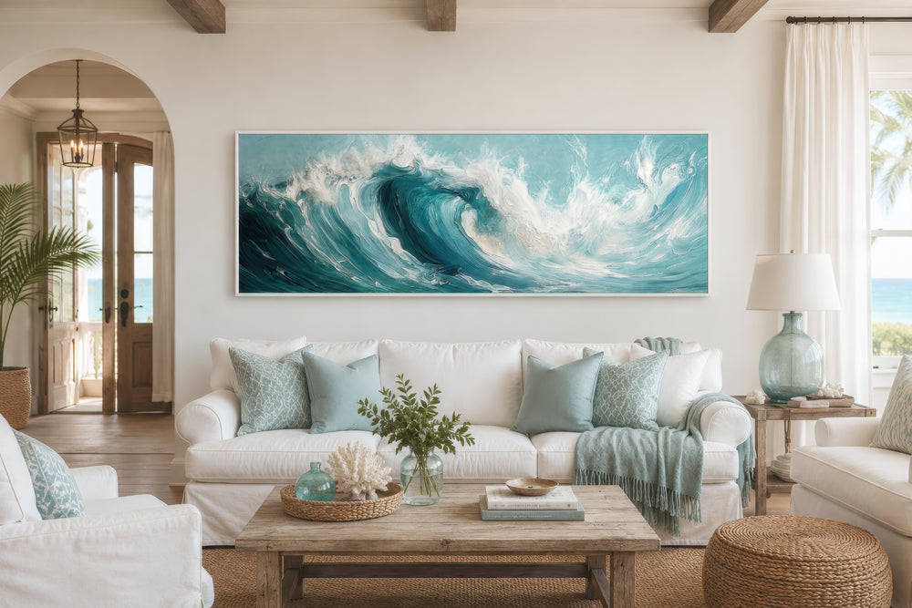 Teal Ocean Wave Coastal Horizontal Framed Canvas Wall Art hanging above a white sofa.