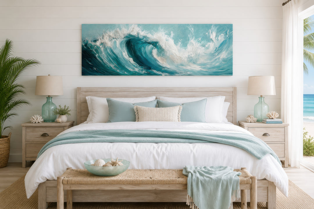 Teal ocean wave coastal horizontal framed canvas wall art hanging above a bed in a beachy bedroom.