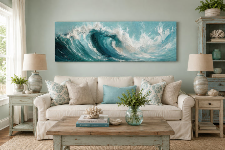 Teal ocean wave coastal horizontal framed canvas wall art hanging above a white sofa.