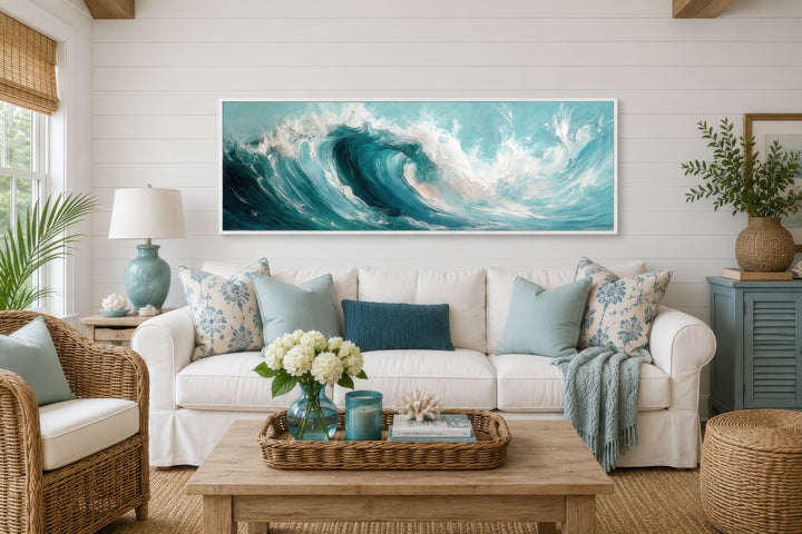 Teal Ocean Wave Coastal Horizontal Framed Canvas Wall Art hanging above a white sofa.