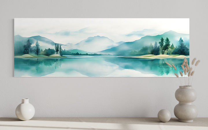 Teal watercolor mountain and lake landscape wall art in a long narrow panoramic format.