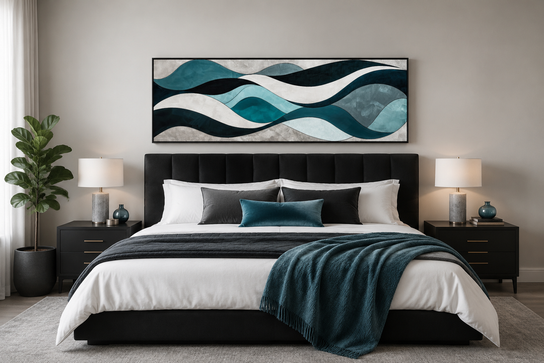 Teal, blue, and grey abstract waves horizontal wall art hanging above a black upholstered bed.