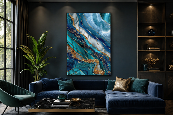 Teal and gold abstract marble framed canvas wall art hanging in a modern dark blue living room.