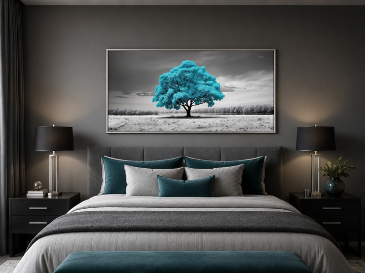 Teal tree on black and white background framed canvas wall art hanging above a bed.