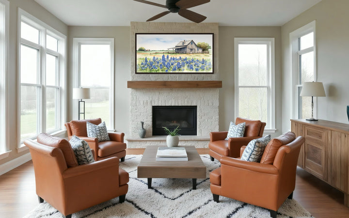 Texas Barn Wall Art canvas featuring a rustic barn and bluebonnet field above a stone fireplace.