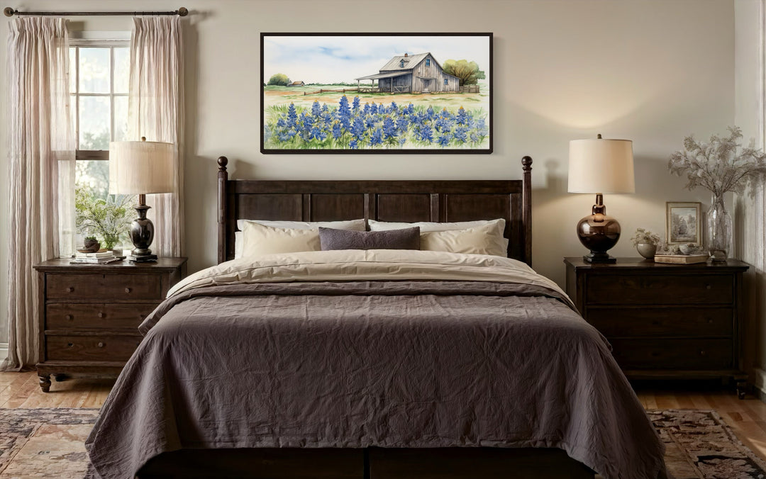 Rustic Texas barn wall art canvas featuring a bluebonnet field above a dark wood bed.