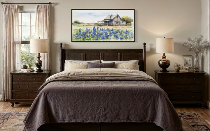Rustic Texas barn wall art canvas featuring a bluebonnet field above a dark wood bed.