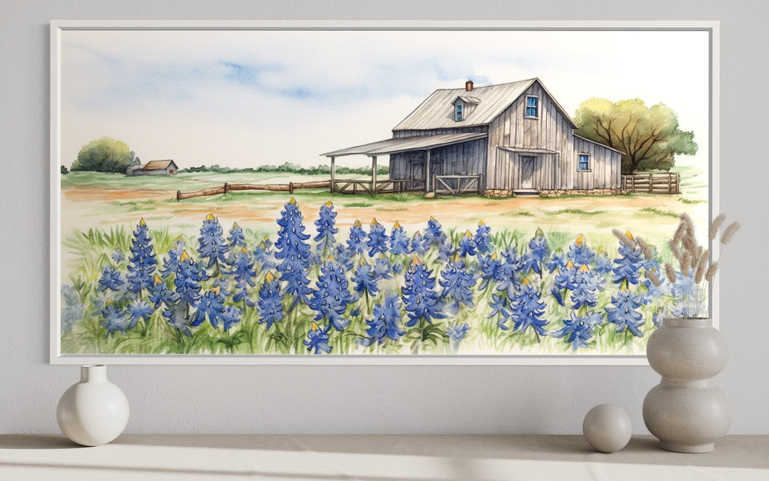 Rustic Texas barn watercolor wall art with a field of bluebonnets in a white frame.