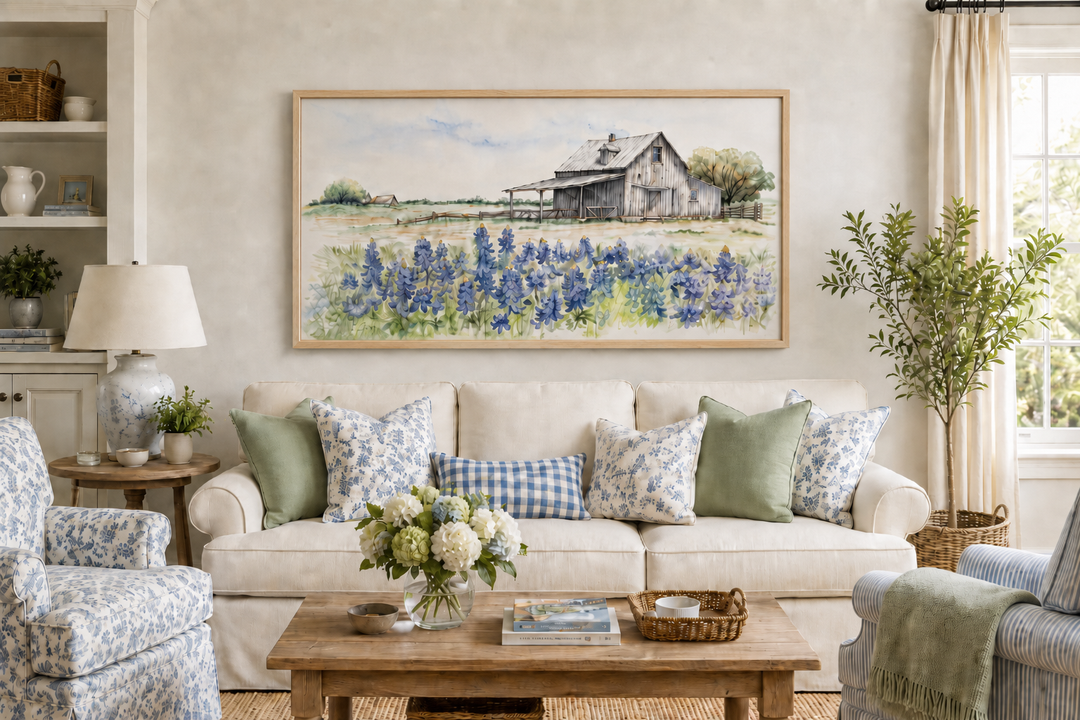 Rustic Texas barn wall art with bluebonnet field print in a light wood frame above a white sofa.