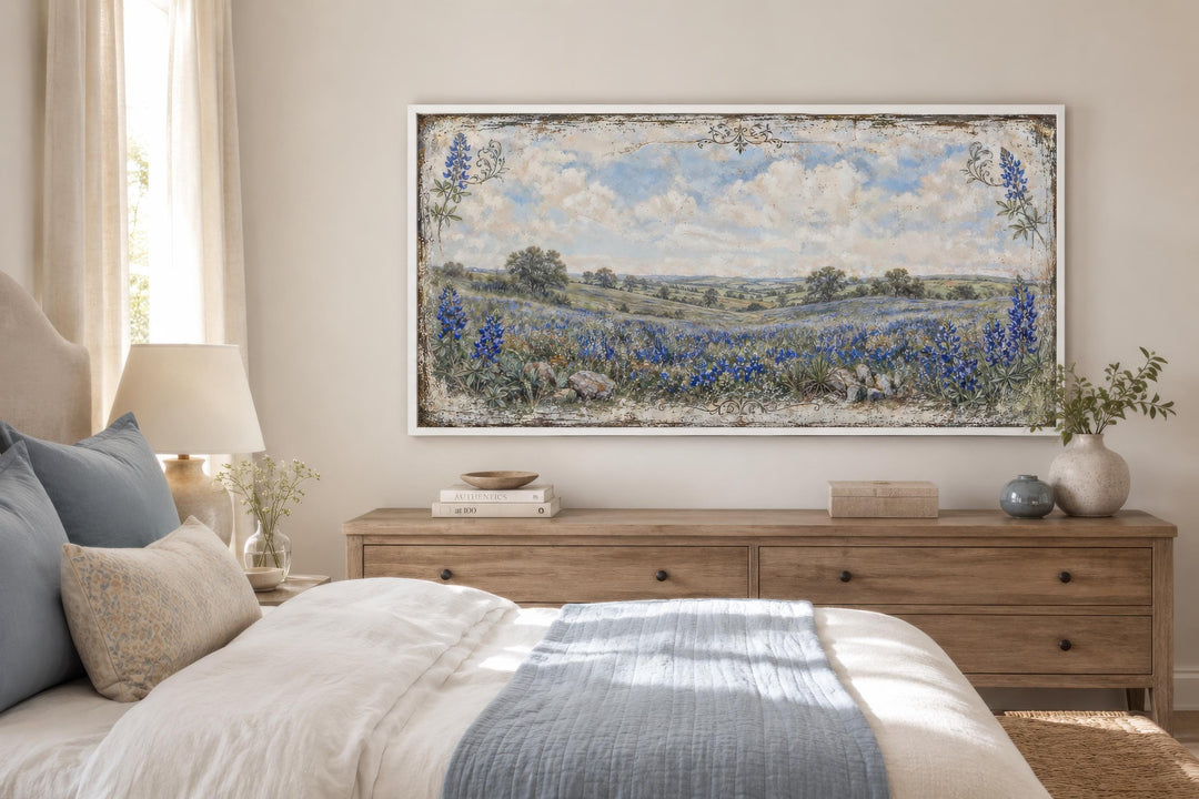 Texas Bluebonnet wall art canvas print hanging above a wooden dresser in a neutral bedroom.