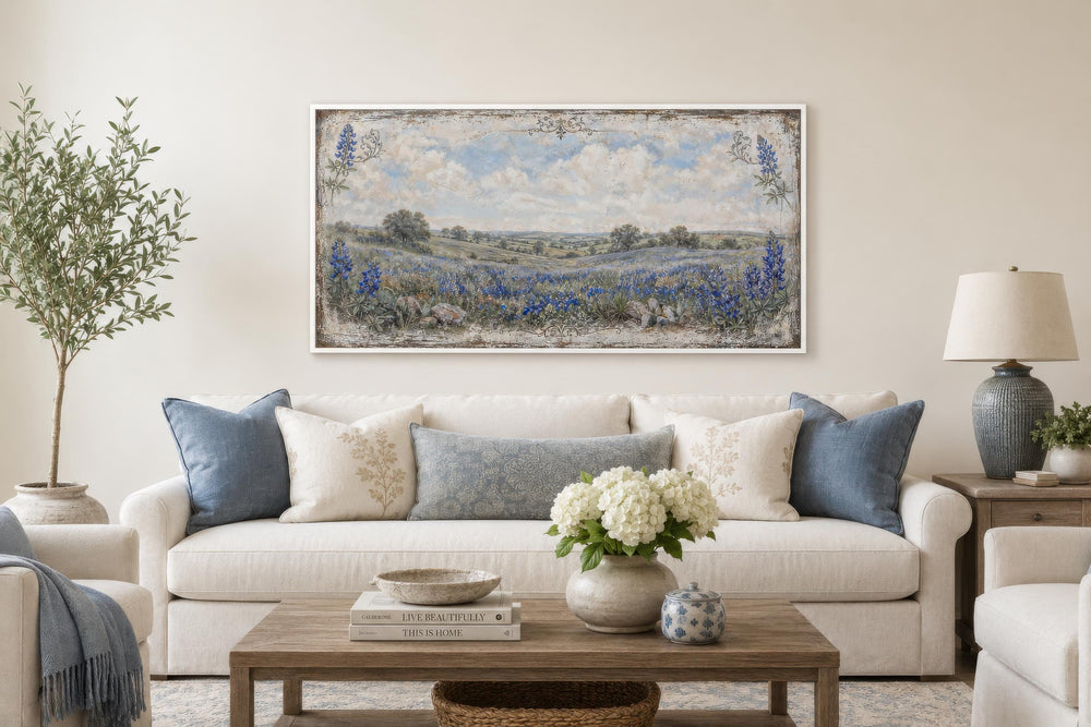 Texas Bluebonnet Wall Art, a vintage wildflower landscape canvas print above a white sofa.