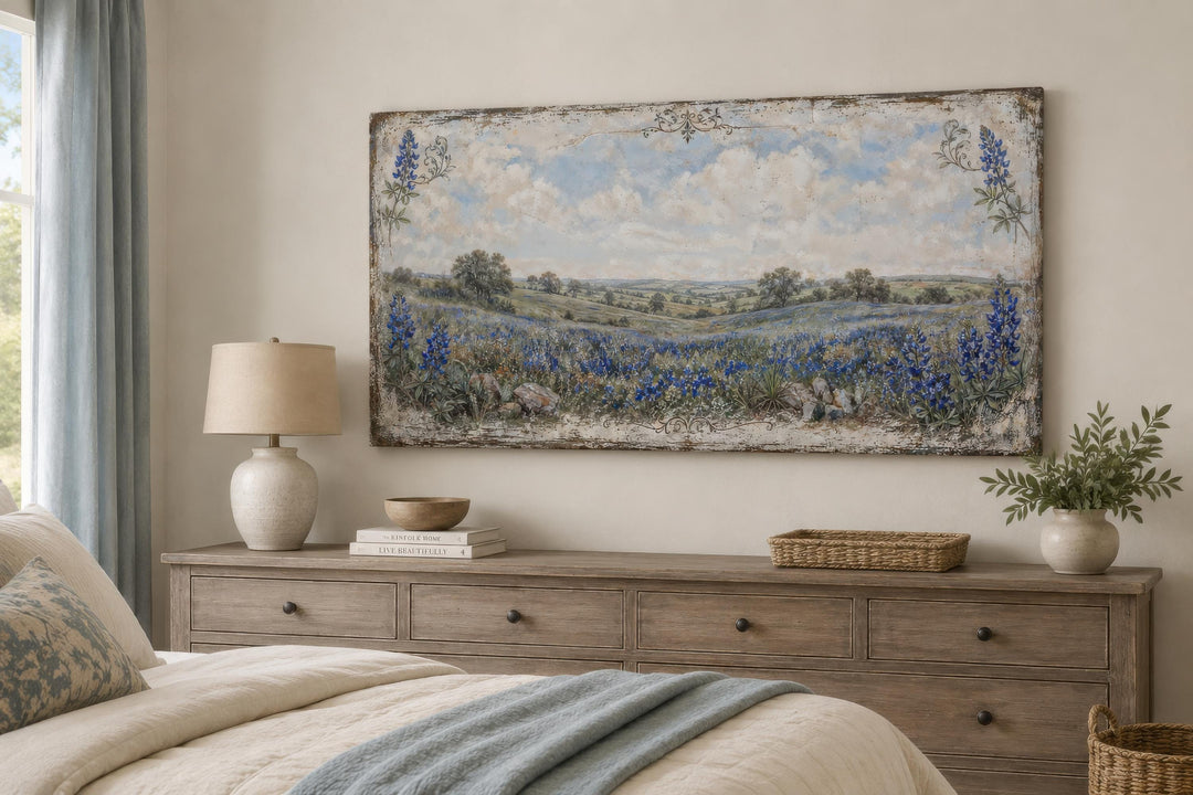 Vintage Texas bluebonnet landscape canvas print hanging above a wooden dresser in a bedroom.