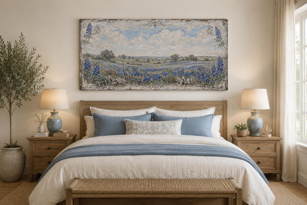 Vintage Texas Bluebonnet landscape canvas print hanging above a bed in a neutral-toned bedroom.