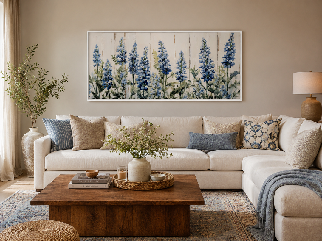 Texas Bluebonnets painted on wood rustic framed canvas wall art above a white sectional sofa.