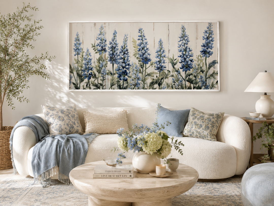 Texas Bluebonnets painted on wood rustic framed canvas wall art above a white sofa.
