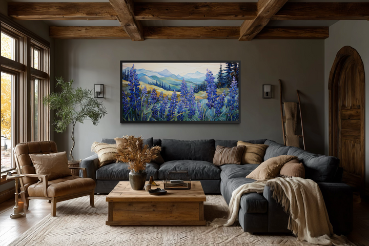 Framed canvas print of Texas bluebonnets in a rustic living room with a dark sectional sofa.