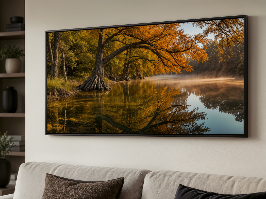 Framed Texas landscape wall art featuring a vibrant fall river scene above a modern sofa.
