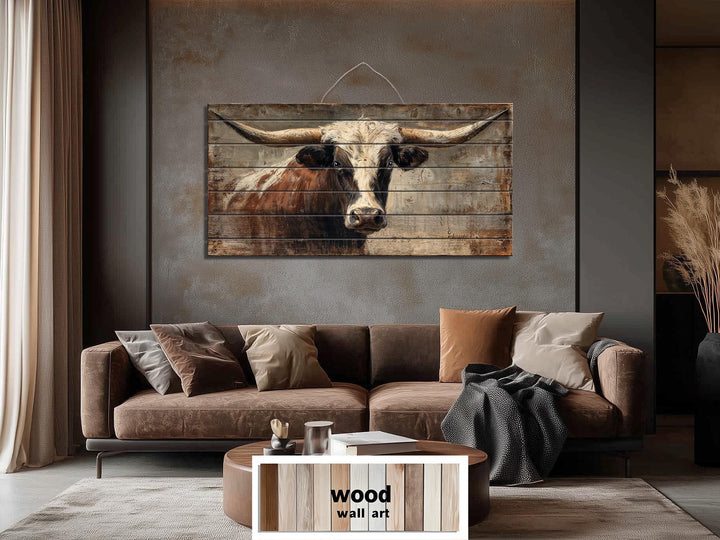 Rustic Texas longhorn bull portrait printed on horizontal wood planks for farmhouse wall decor.