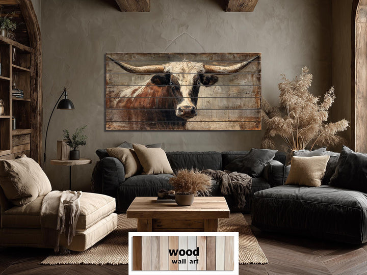 Large horizontal wood wall art featuring a realistic Texas longhorn bull in a rustic living room.