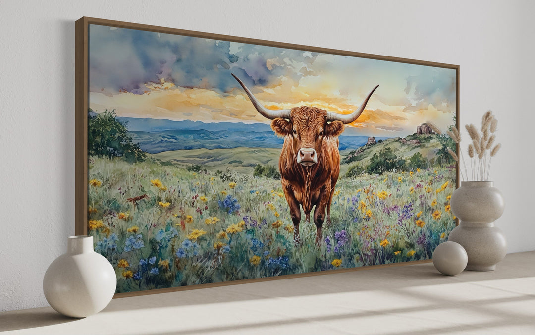 Texas Longhorn cow in wildflowers field framed canvas wall art.