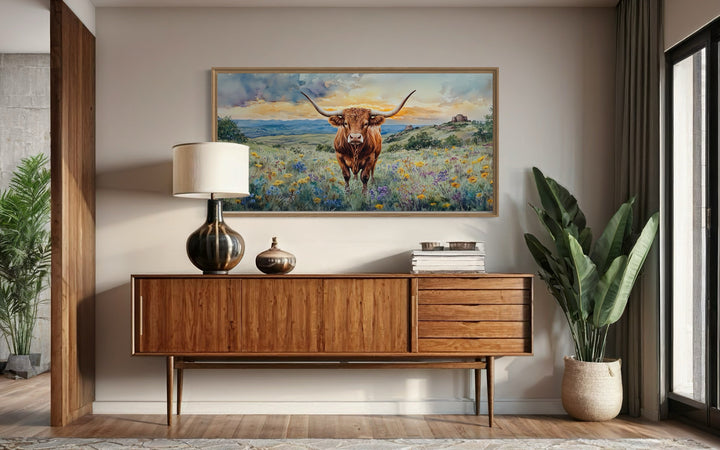 Texas Longhorn cow in wildflowers field framed canvas wall art.