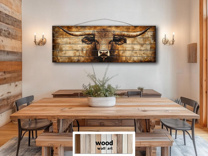 Texas Longhorn horizontal wood wall art hanging above a rustic dining table in a farmhouse room.