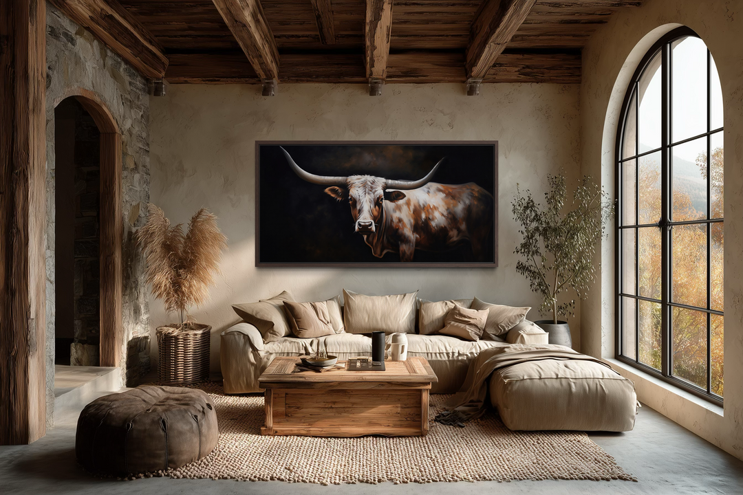 Extra large framed canvas wall art of a Texas Longhorn cow in a rustic farmhouse living room.