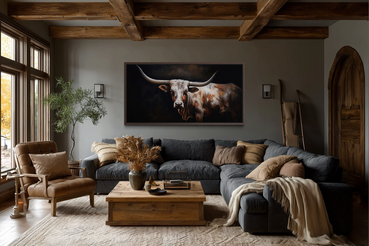 Extra large framed canvas wall art featuring a Texas Longhorn painting in a rustic living room.