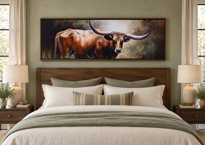 Texas Longhorn steer panoramic framed canvas wall art hanging above a bed in a sage green bedroom.
