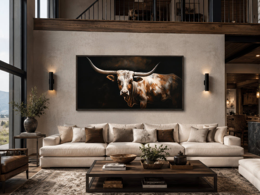 Extra large framed canvas wall art of a Texas Longhorn cow in a rustic farmhouse living room.