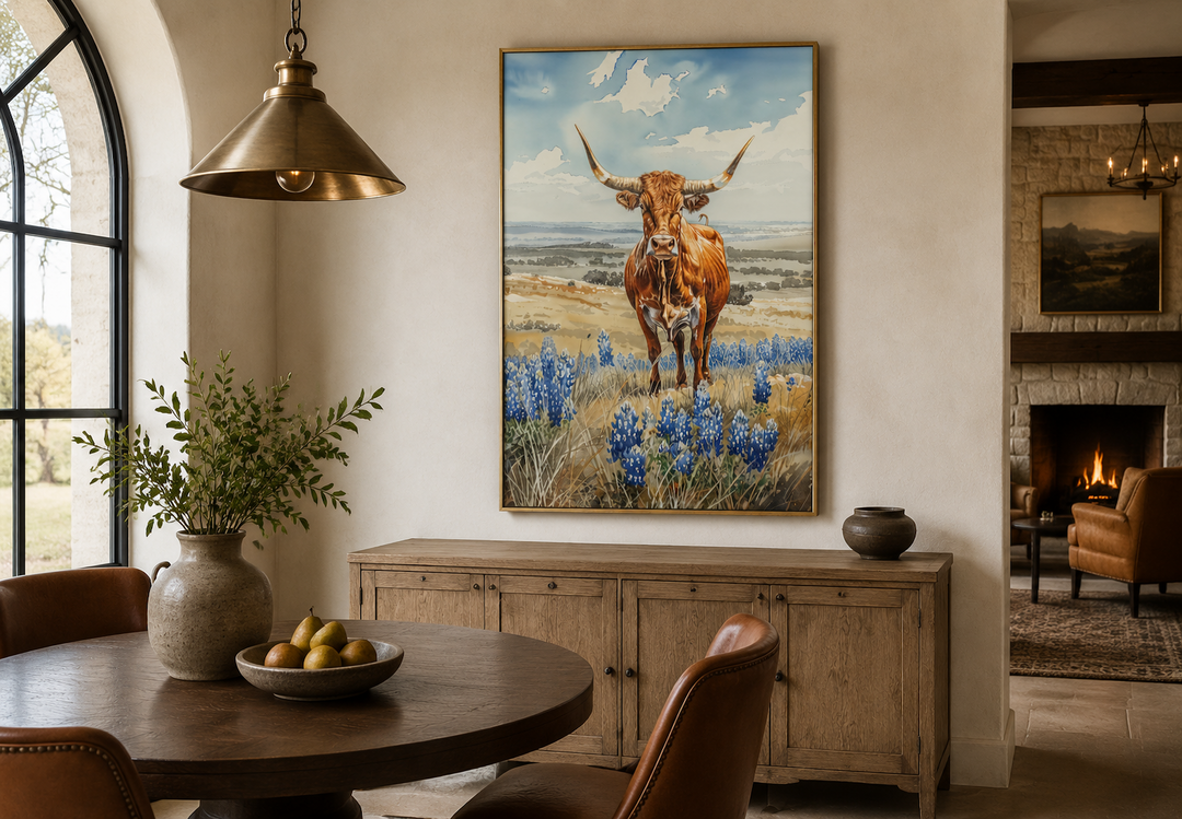 Vertical framed canvas wall art of a Texas longhorn cow in a field of bluebonnets.