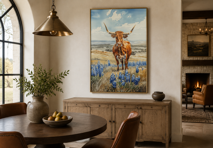 Vertical framed canvas wall art of a Texas longhorn cow in a field of bluebonnets.