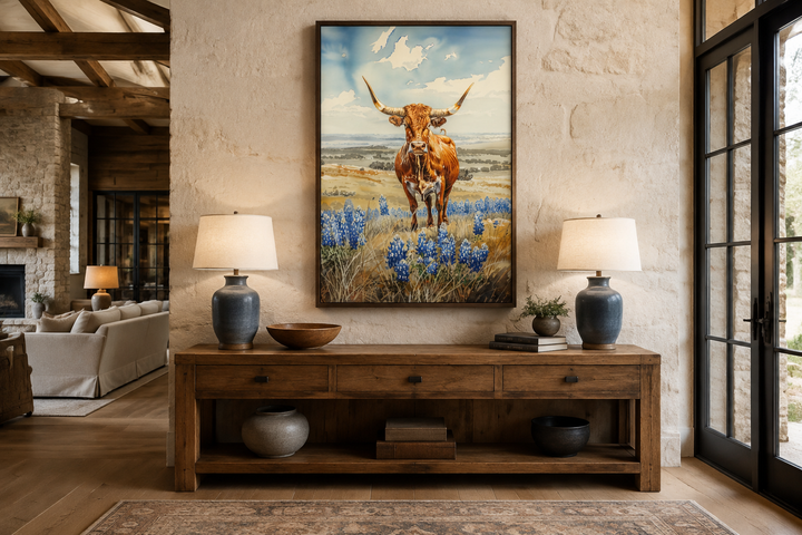 Vertical framed canvas wall art of a Texas longhorn cow in a field of bluebonnets.